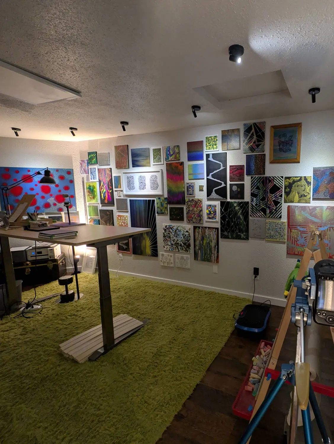 Paintings and works in progress gathered on the studio wall