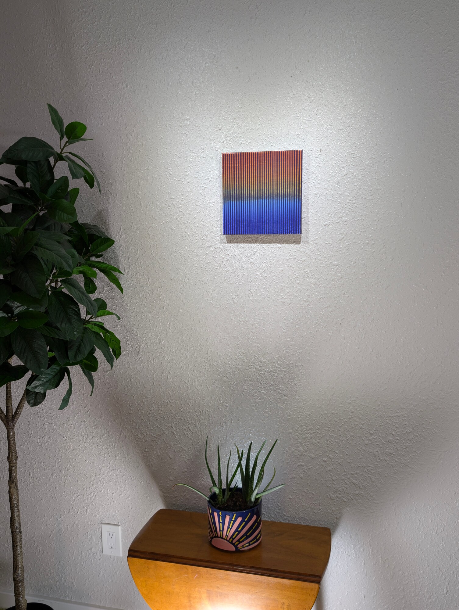 Frequencies No. 1 installed above a small wooden table
